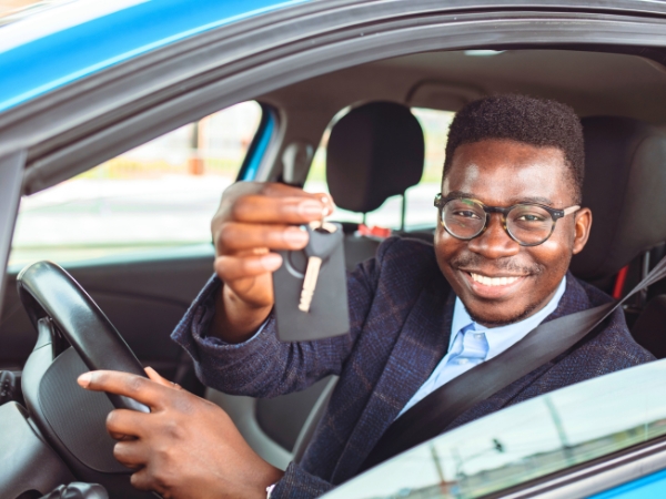 Man Driving a Blue Car